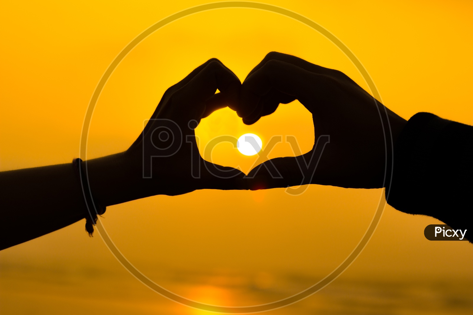 Image of Couple Hands Making A Heart Love Sign Sillhoute During ...