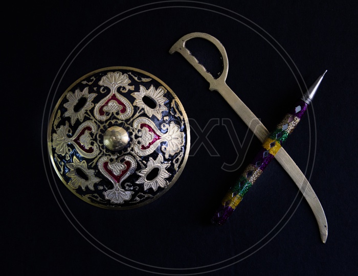 Pen Is Mightier Than Sword Concept By Decorated Round Sword Shield And Pen In Black Background .Antique Artefact