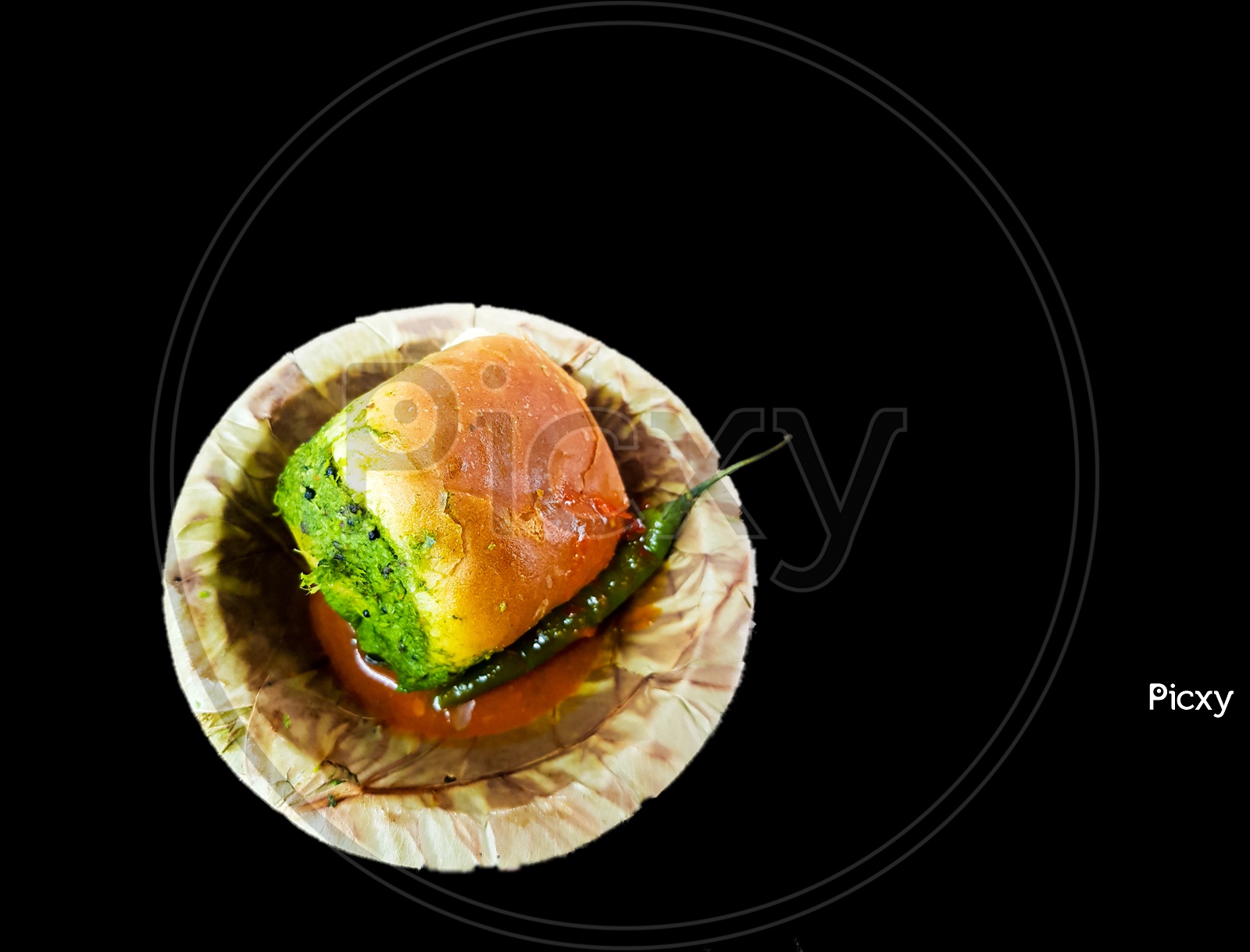 Vada Pau Bread And Green Sauce On A Plate In Dark Background