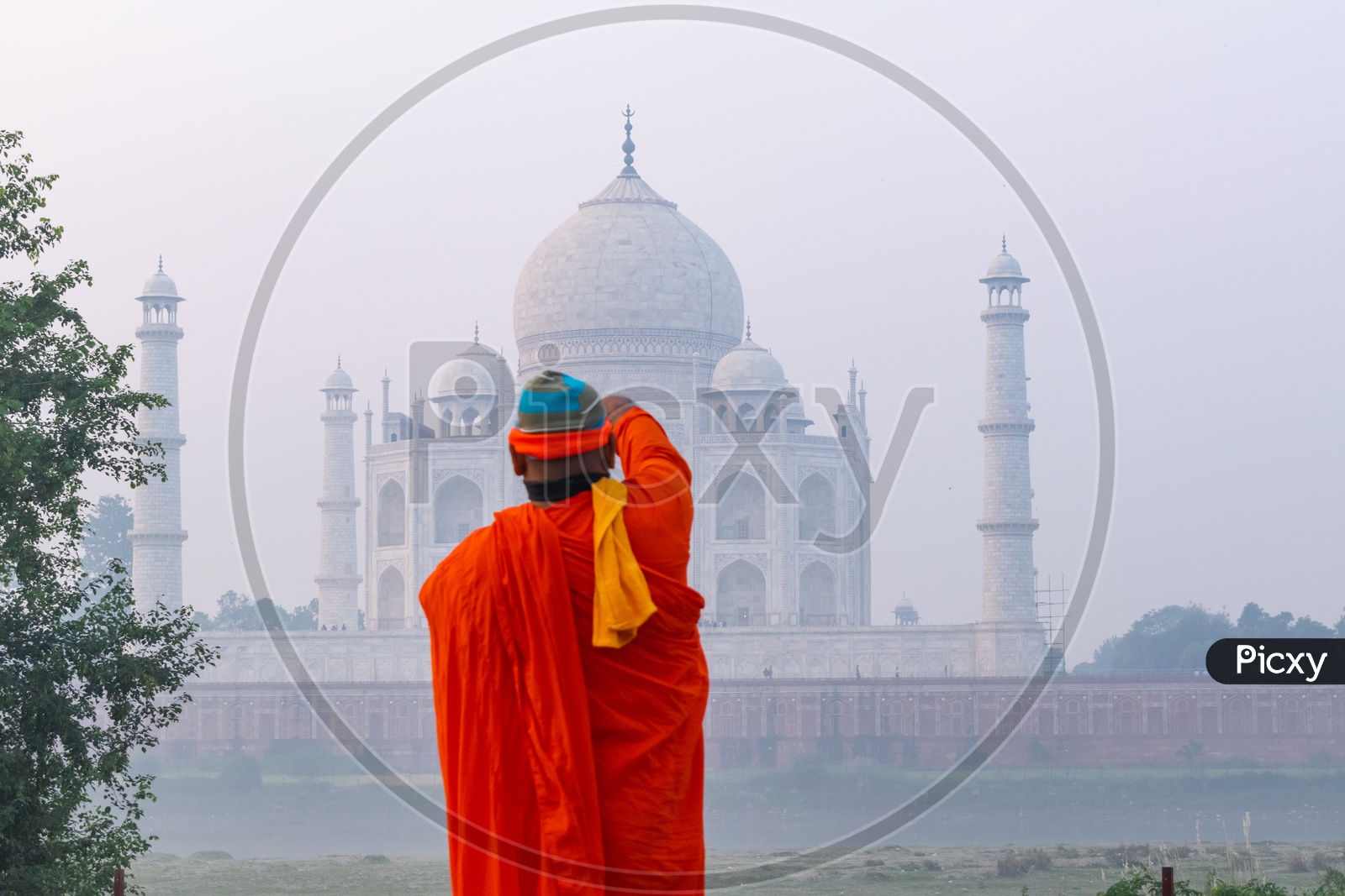 A Buddhist Monk or Saint  At  Taj Mahal On a Foggy Morning