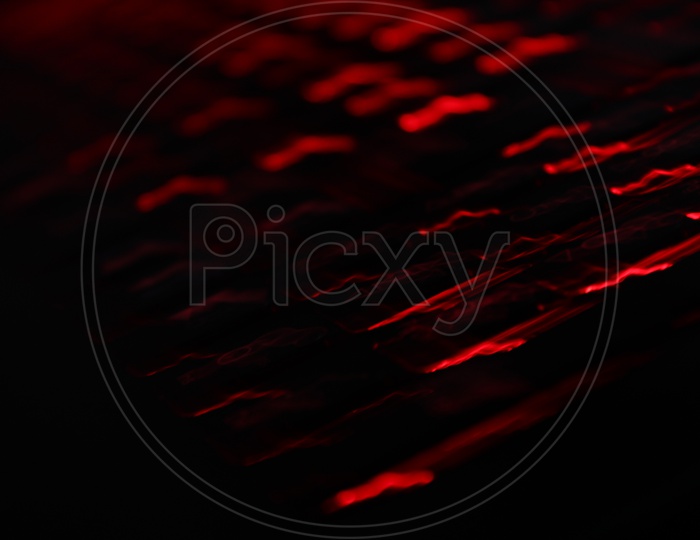 Bokeh Background Of Patterns Of Red LED Light Over Black
