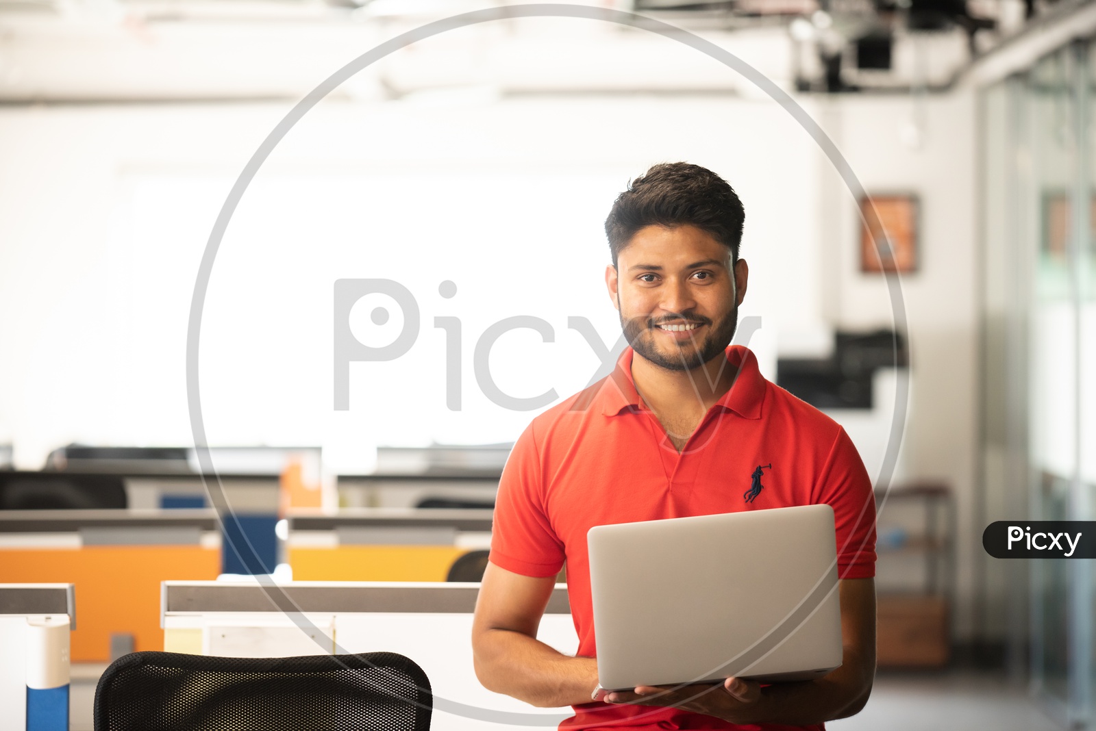 Young Indian Male Student with Laptop