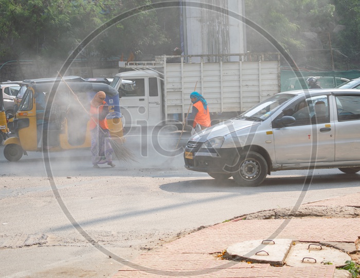 GHMC Workers Sweeping Roads in Hyderabad City