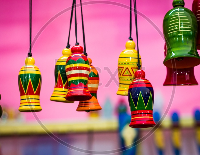 Colourful Wooden Bells Hanging By String. Musical Instrument