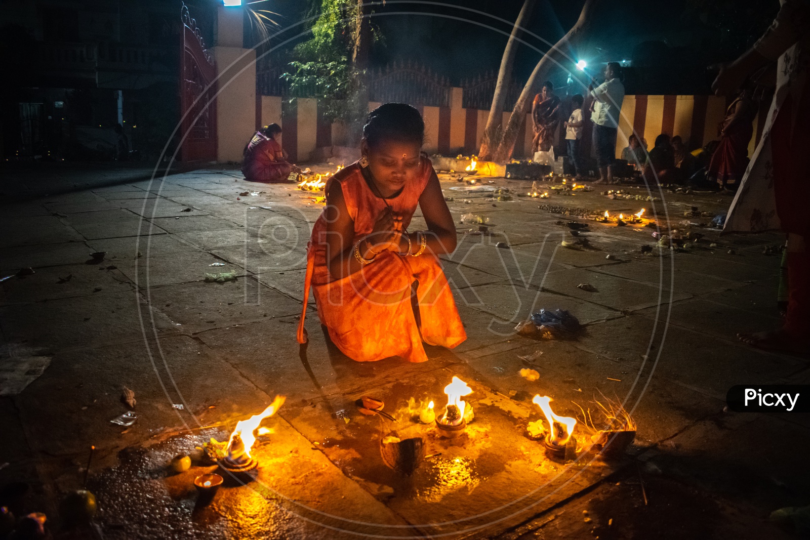 Girl praying to God on Diwali