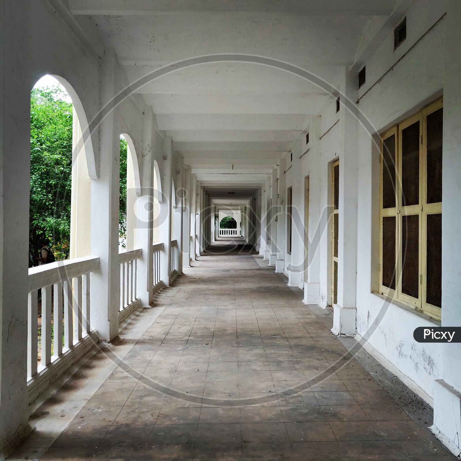 Architecture Of a Balcony Hall With Windows And Pillars
