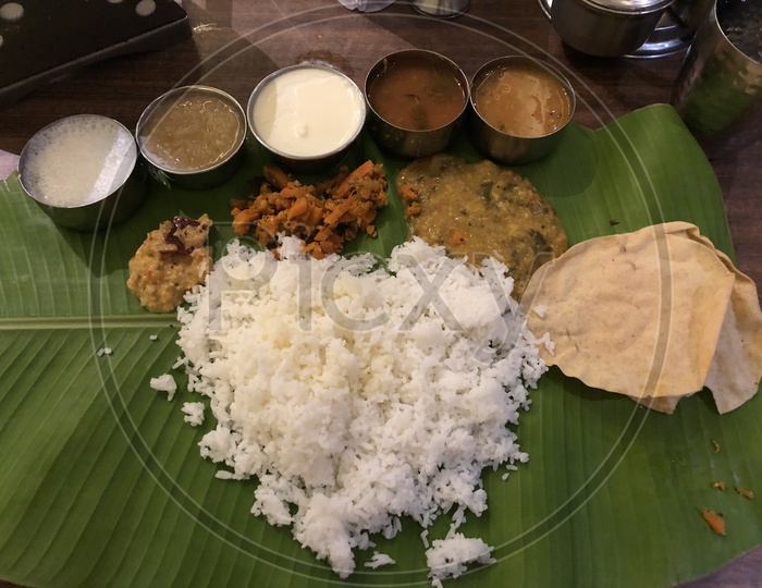 Banana leaf Lunch In Traditional Andhra Style Meals Served  At a Restaurant