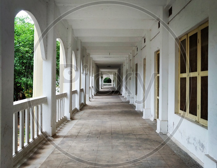 Architecture Of a Balcony Hall With Windows And Pillars