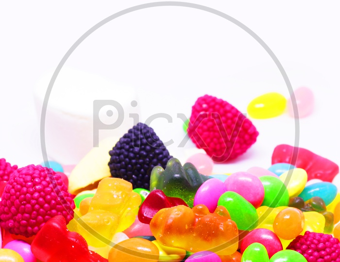 Multiple Coloured Sugar Candy In White Background In Vertical Orientation