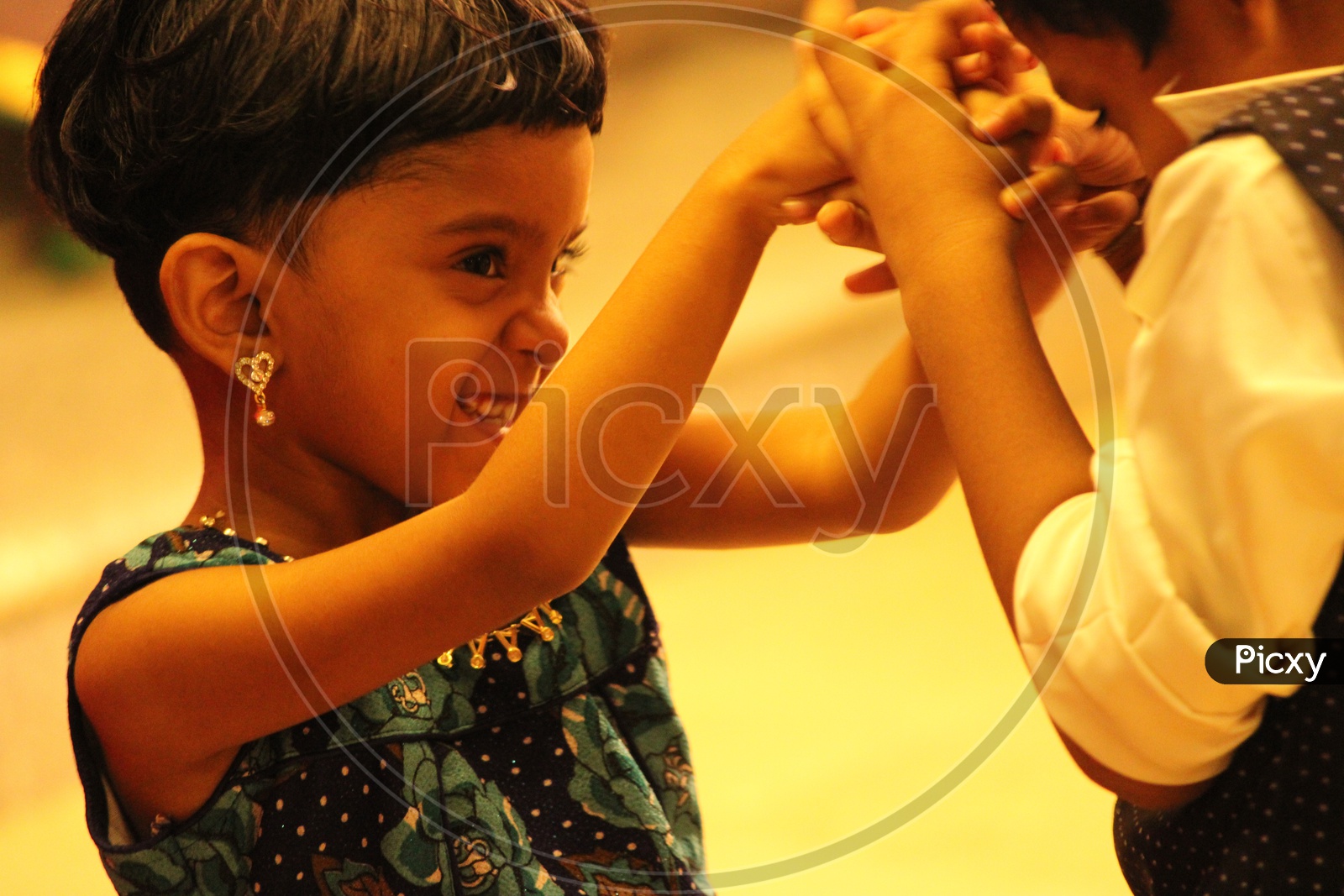 Young Girl Playing With Brother Or Sibling