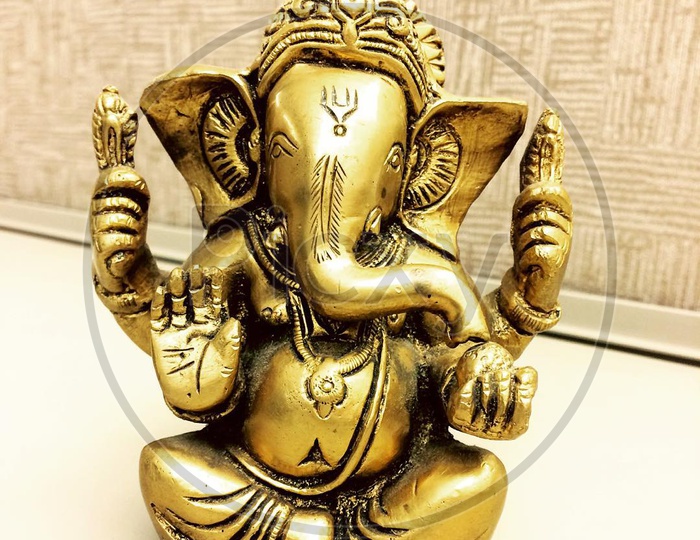 Ganesha brass idol in cubicle