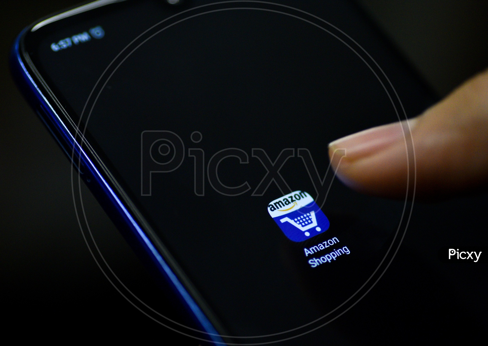 Amazon Online shopping  Mobile App Icon Opening on Smartphone Screen  Closeup With Finger