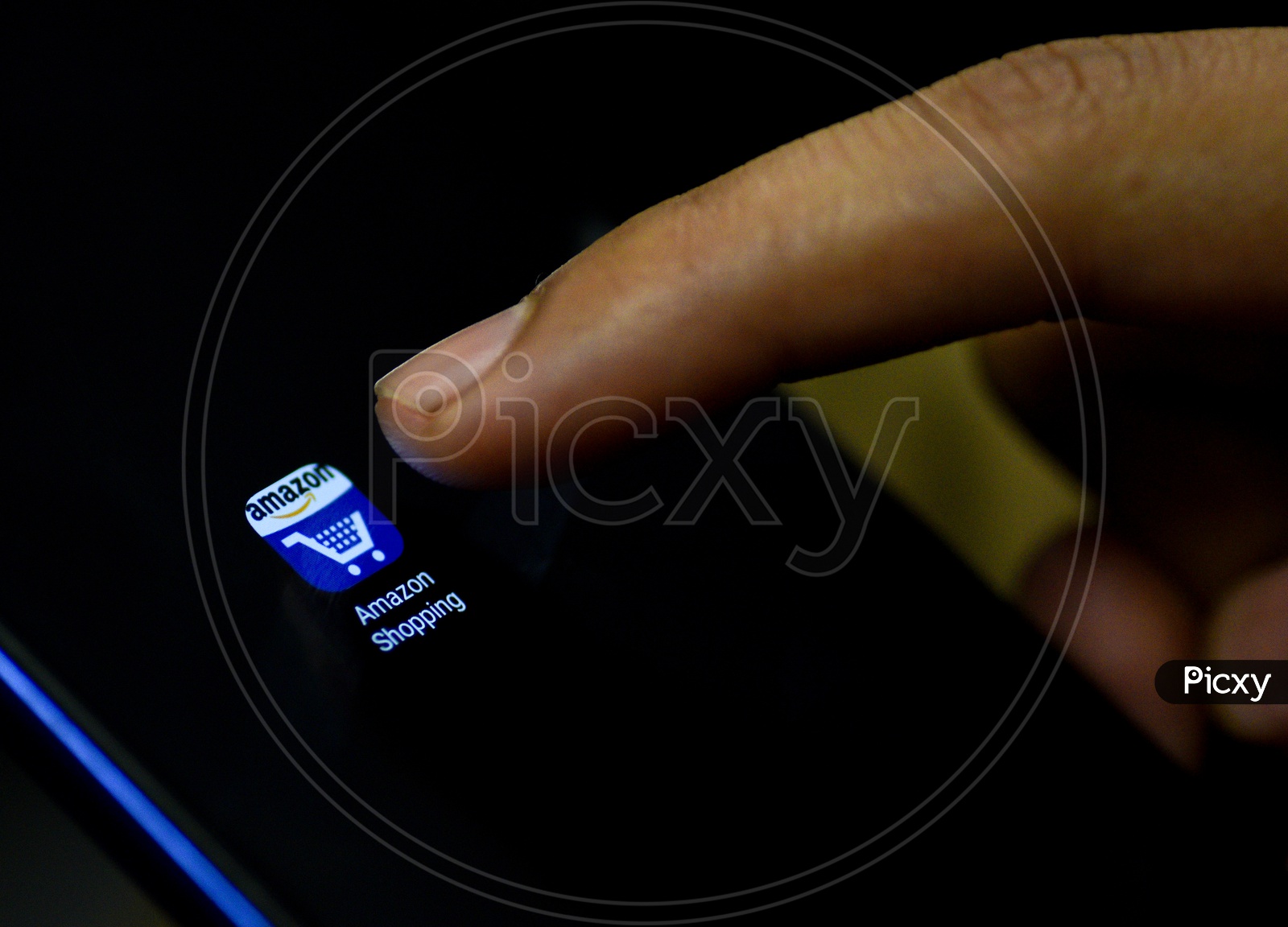 Amazon Shopping Mobile App Icon Opening on Smartphone Screen  Closeup With Finger