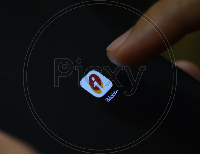 ICICI Online Mobile Banking  App Icon Opening on Smartphone Screen  Closeup With Finger