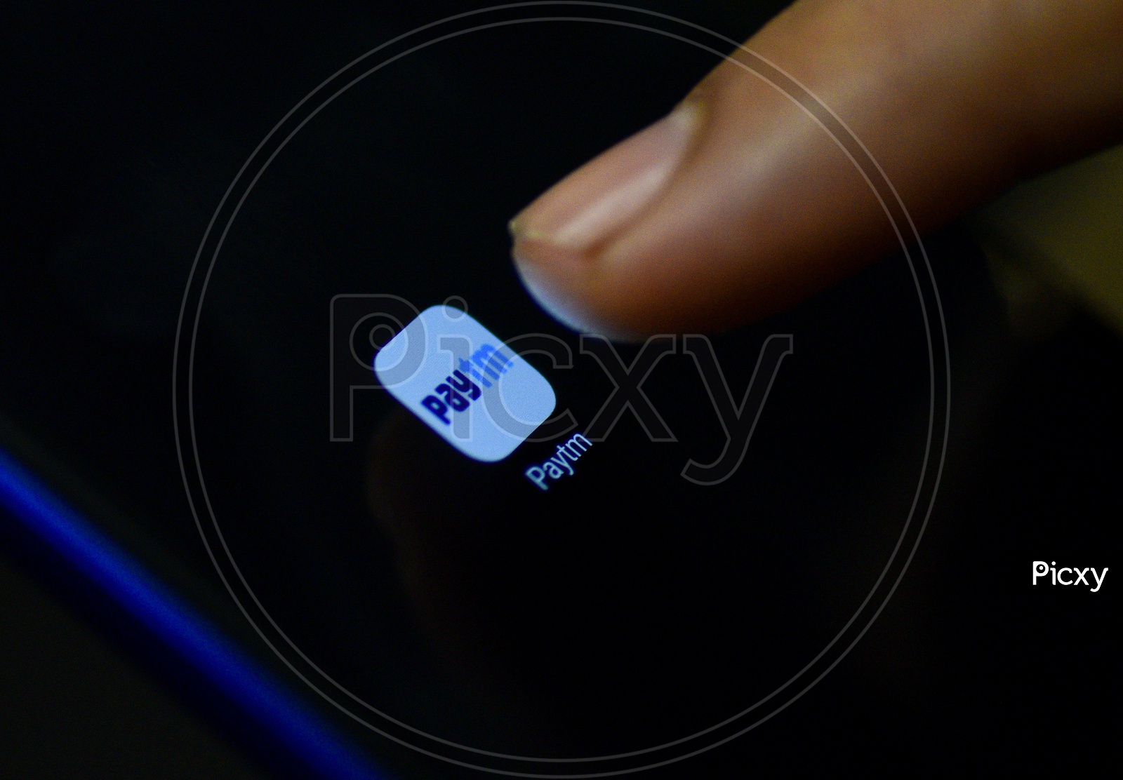 Paytm Online Payment  Mobile App Icon Opening on Smartphone Screen  Closeup With Finger