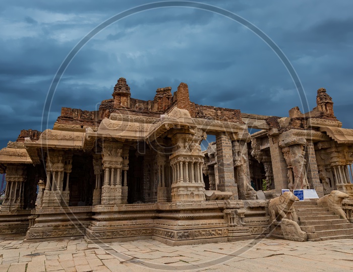 Temple Ruins in Vittala Complex in Unesco World Heritage Town Hampi on a cloudy day