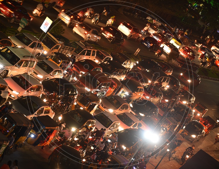 Traffic Jam In An Urban City At a Traffic Signal With Cars, Bikes And Autos Stranded