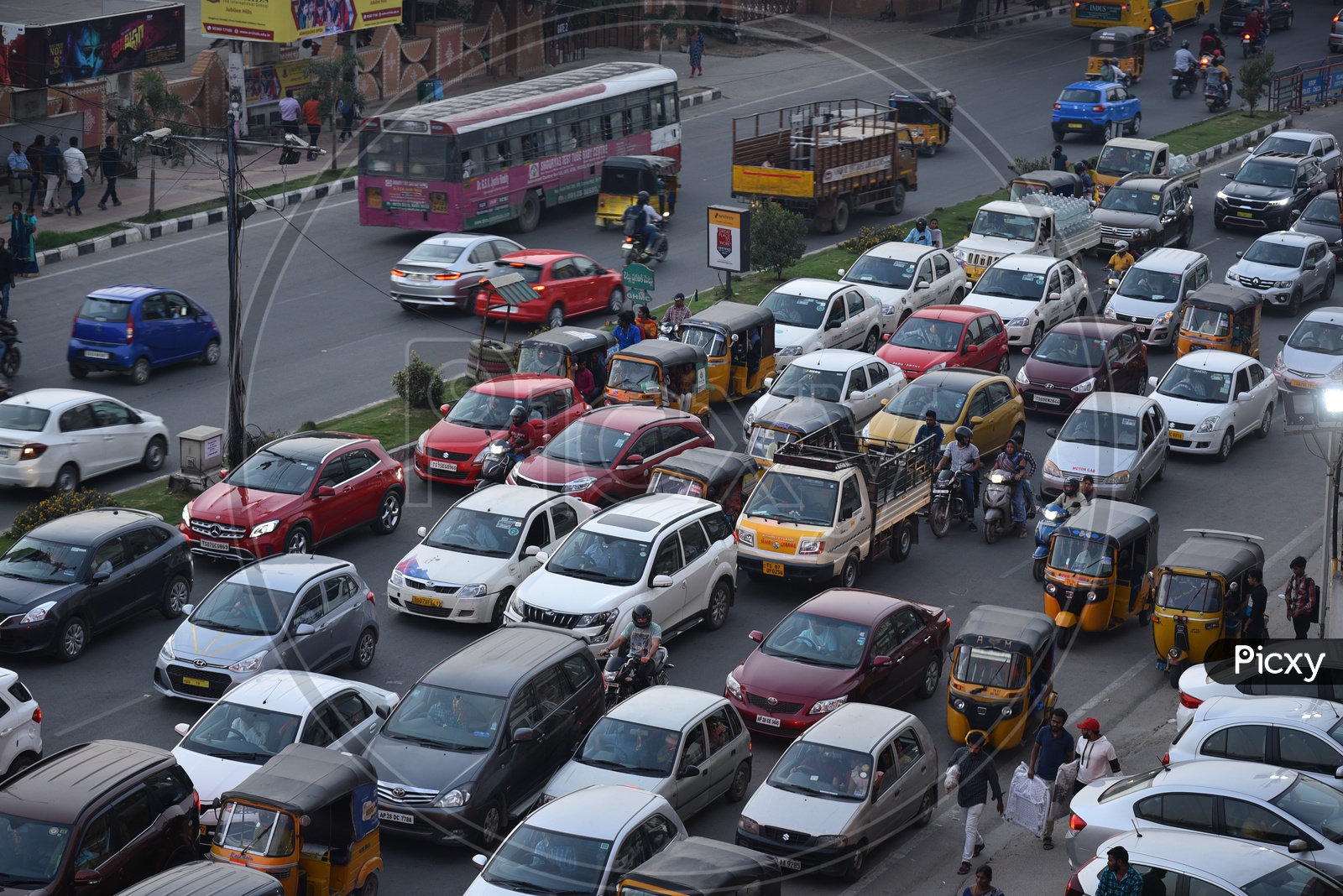 Traffic Jam In An Urban City At a Traffic Signal With Cars, Bikes And Autos Stranded