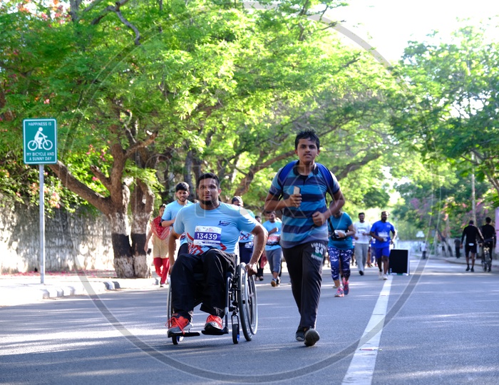 Man participating in a marathon in wheelchair