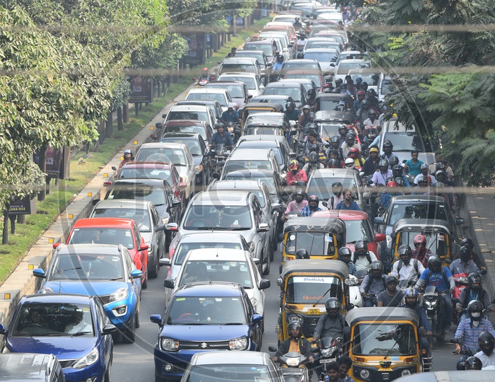 Traffic Jam With Office Going Employees waiting in Cars And On Bikes