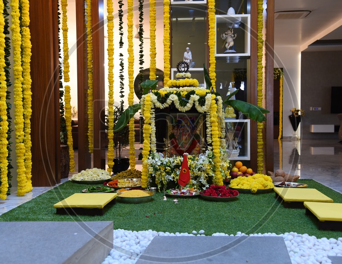 Image of Hindu Pooja With God Photo frames And Flower Decoration -EO287792-Picxy
