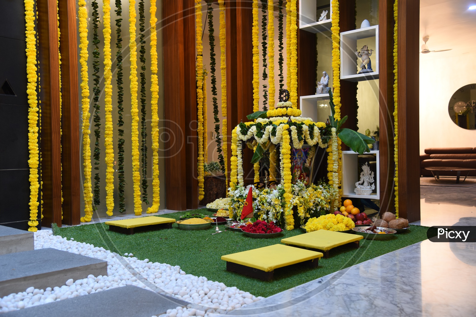 Hindu Pooja With God Photo frames And Flower Decoration