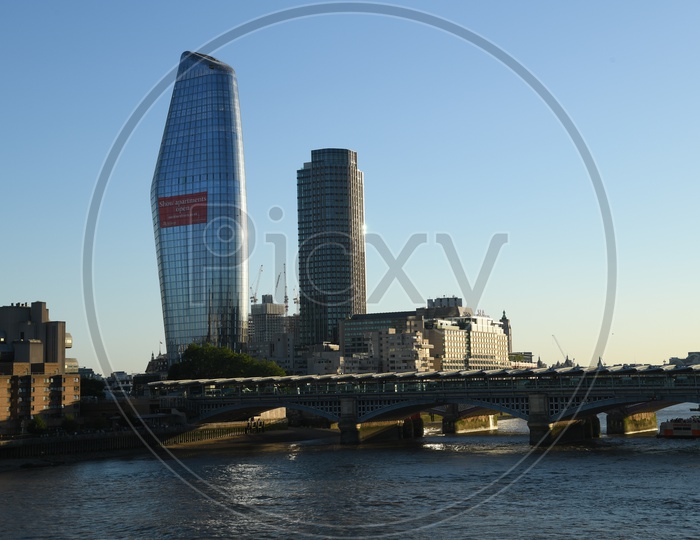 Skyscraper Buildings On The Bank Of Thames River in London