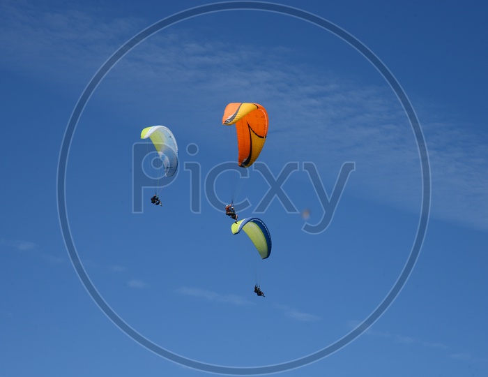 Para gliders  Flying in Air With Blue Sky as Background