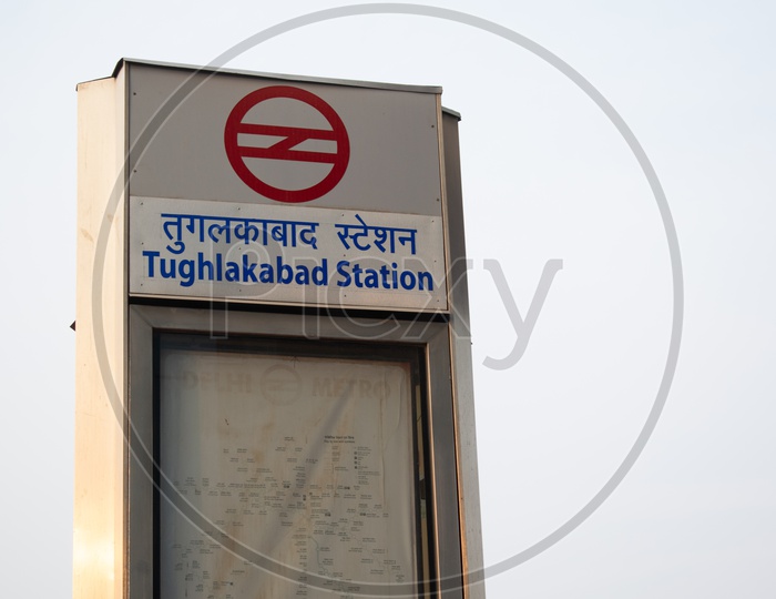 Tughlakabad Metro Station sign board and Delhi metro map
