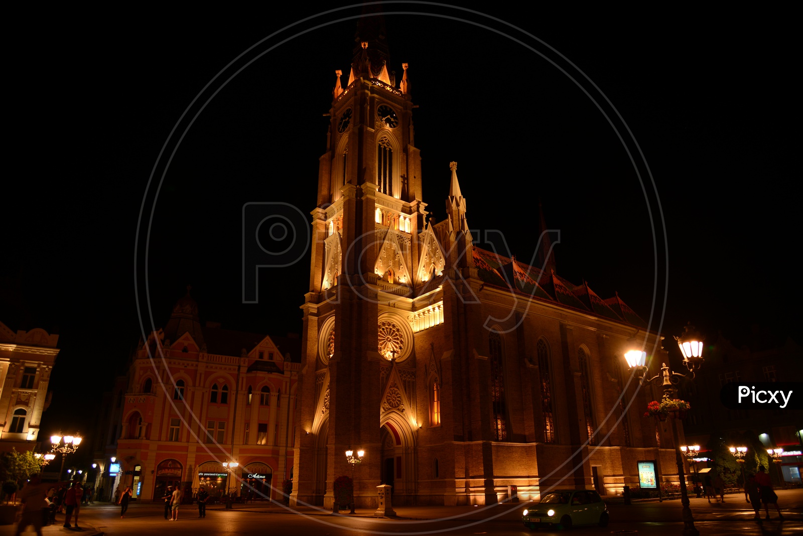 Catholic Church in City Square In Paris With Night Lights