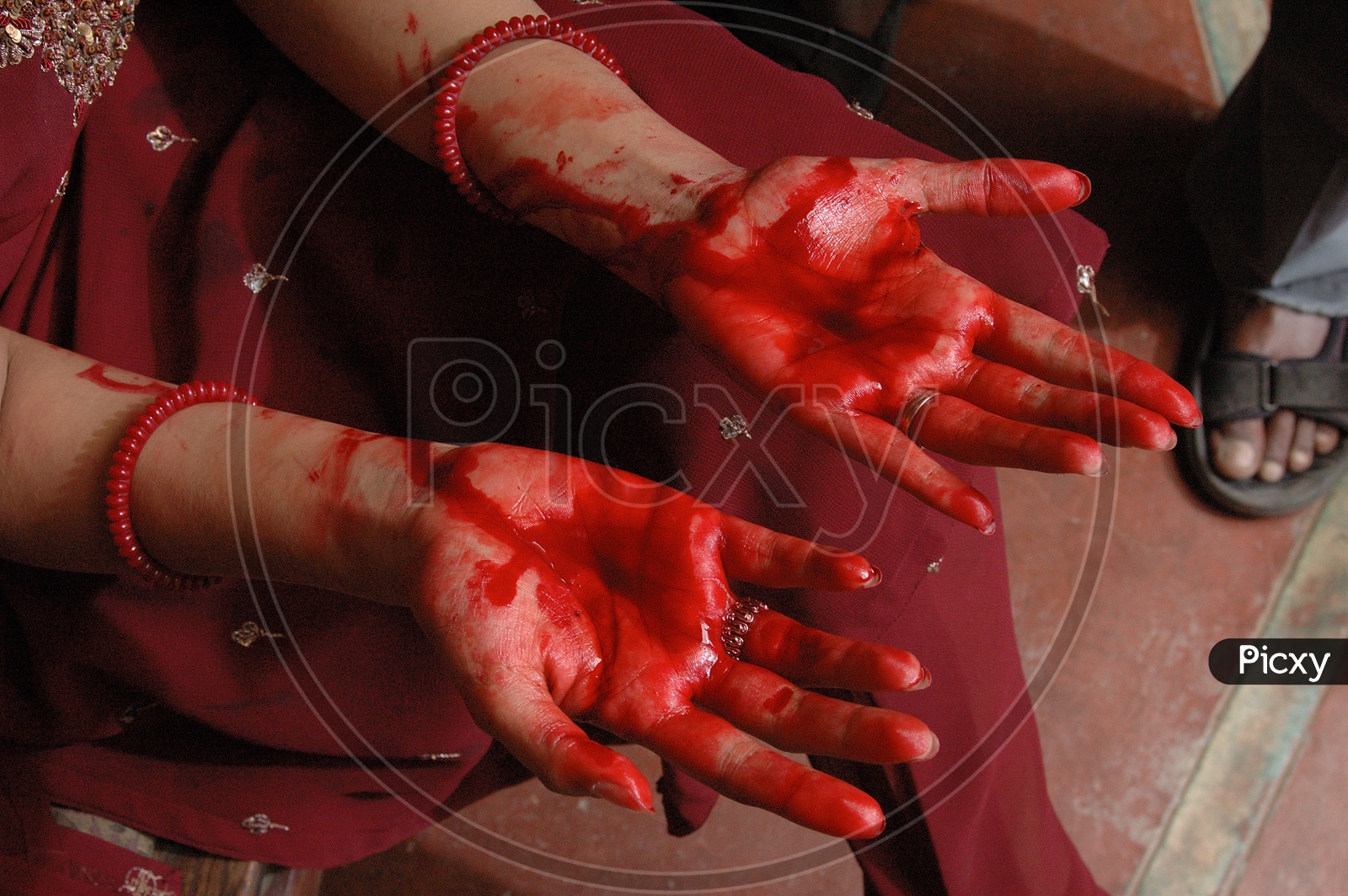 A Woman Hand Filled With Blood Stains in Movie Working Stills