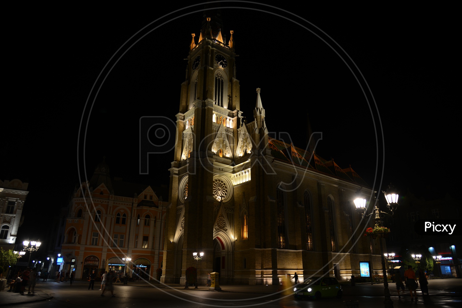 Catholic Church in City Square In Paris With Night Lights