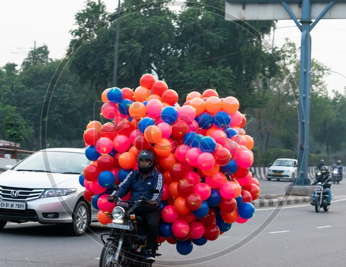 A man carrying balloons