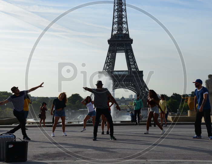 Hip-Hop Dancers Dancing on Street With Eiffel Tower In Background