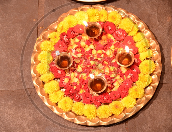Hindu Traditional Pooja Thali With Diyas And Flowers Closeup