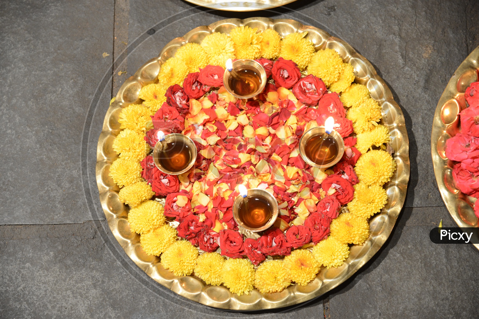 Pooja Thali  With Diyas And Flowers Closeup