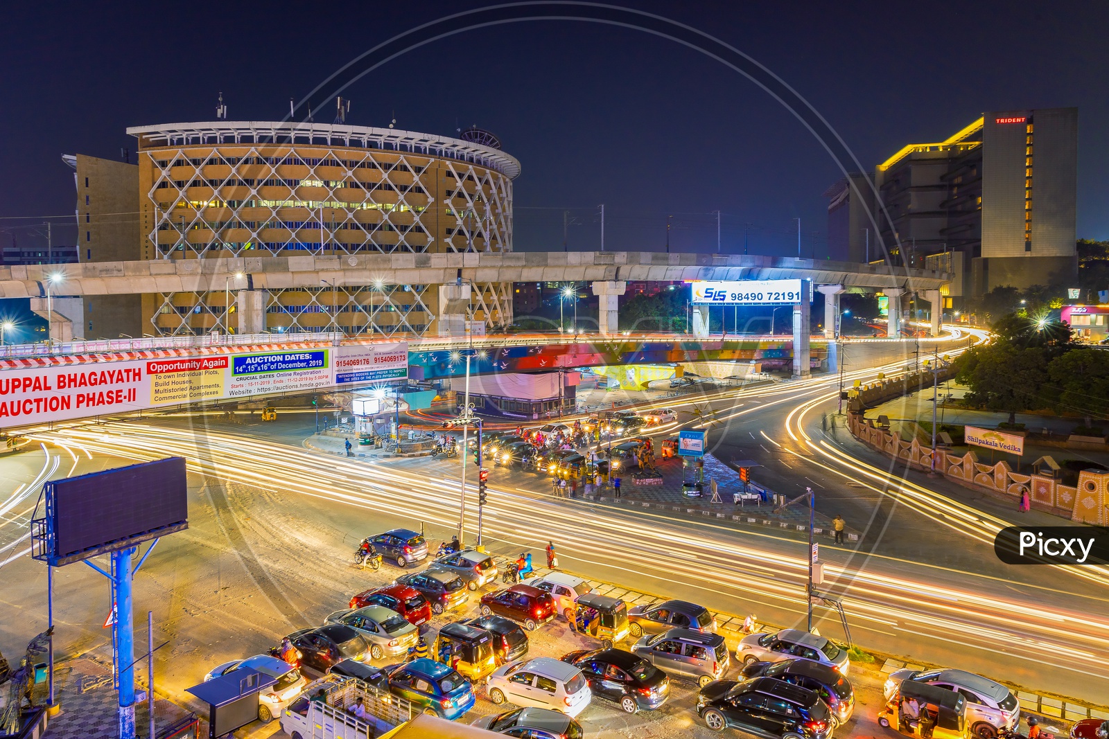 Long Exposure Shot Of Hi-tech City Traffic Signal With Cyber towers in Background