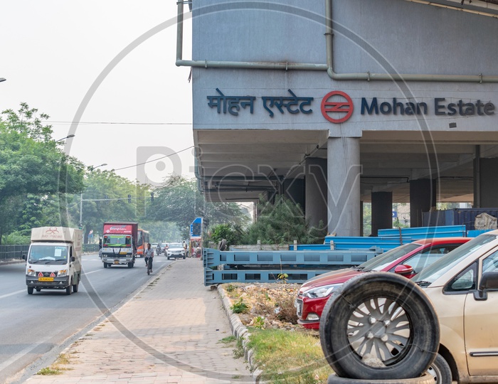 Mohan Estate metro station and vehicles on road