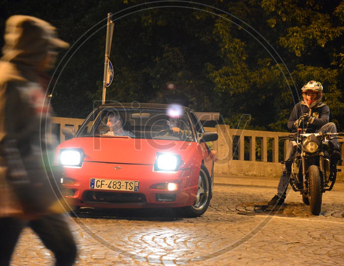 Biker And Car Racer At Streets of belgrade