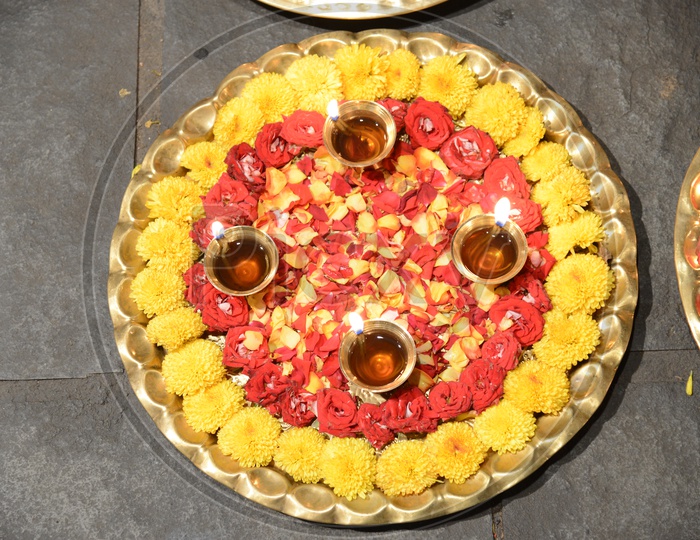 Pooja Thali  With Diyas And Flowers Closeup