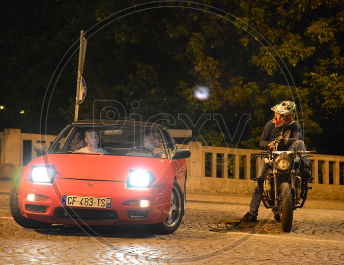 Biker And Car Racer At Streets of belgrade