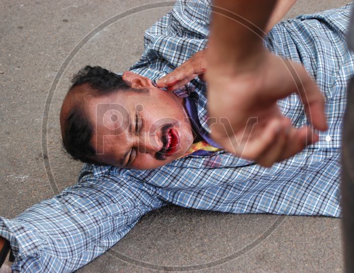A Man Beaten By Another Man Bleeding Closeup