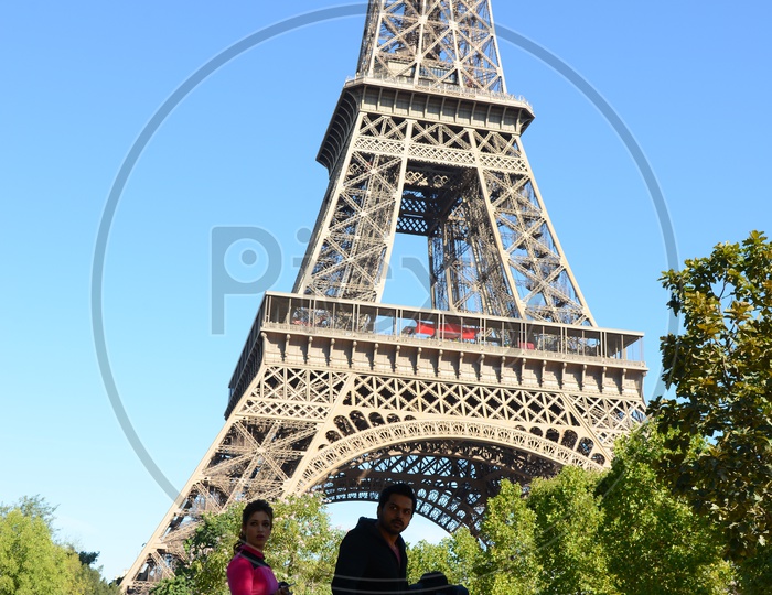 Tourists Enjoying The Eiffel Tower View in Paris