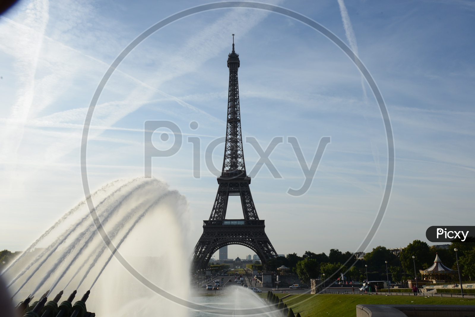 Eiffel Tower View With Water Fountain And Blue Sky Background