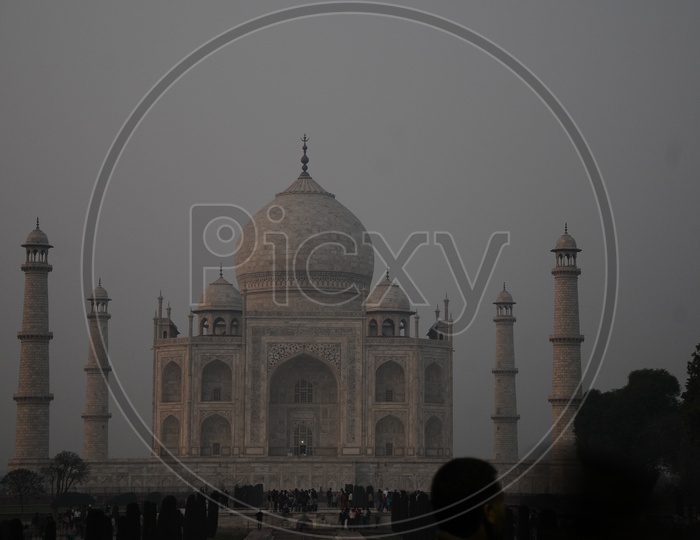 Beautiful View Of Taj Mahal With Tourists At Fountain