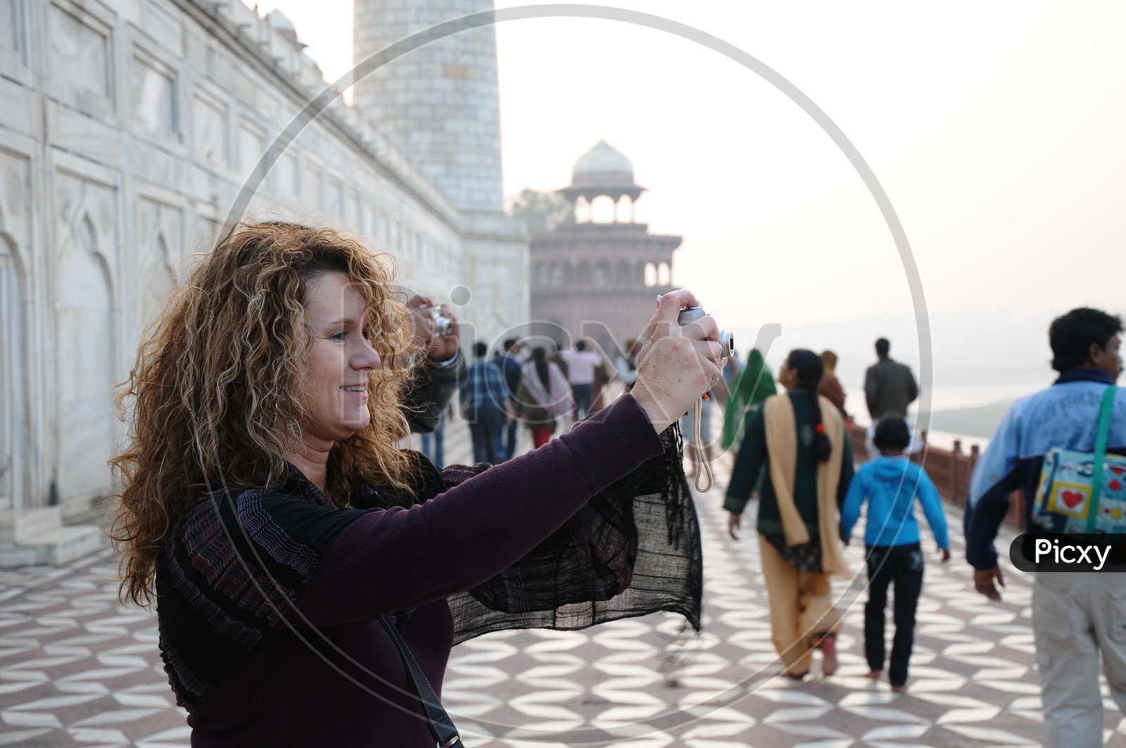 Tourists Taking Pictures At Taj Mahal