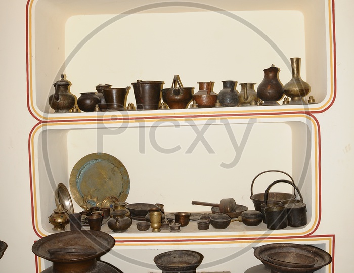 Gallery With Vintage Vessels And Weapons In Display At Amer Fort in Jaipur
