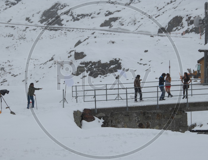 Movie Shooting Crew in Snow Filled Mountains