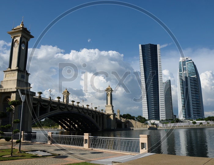 A View Of Skyscrapers And  Putra Bridge With Putra Lake in Foreground