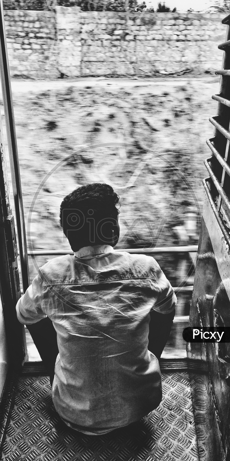 Rail journey- enjoying- black and white